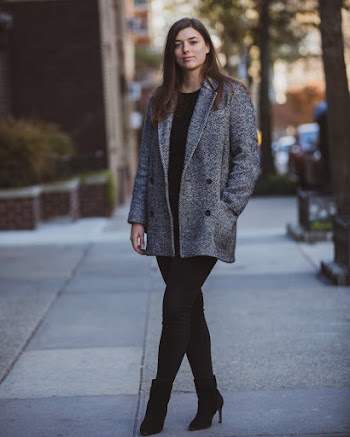 Selective Focus Photo of Woman Standing on Concrete Pavement