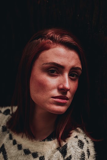 Selective Focus Photo of Woman Wearing Black and White Top