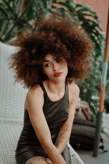 Selective Focus Photo of Woman Wearing Black Tank Top