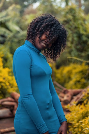 Selective Focus Photo of Woman Wearing Blue Turtleneck Long-sleeved Top