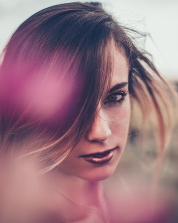 Selective Focus Photo of Woman Wearing Purple Lipstick