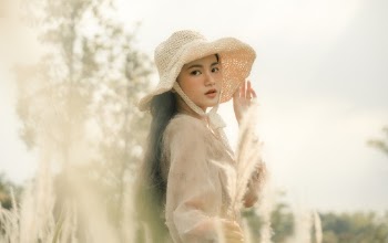 Selective Focus Photo of Woman Wearing Sun Hat
