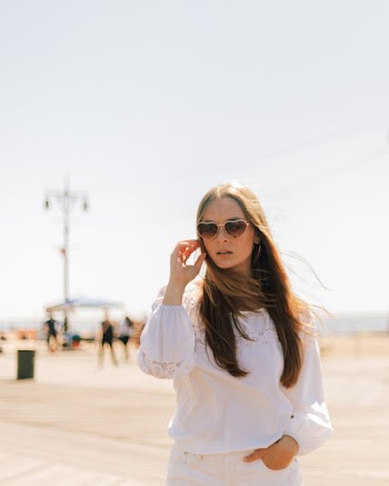 Selective Focus Photo of Woman Wearing White Long-sleeved Top