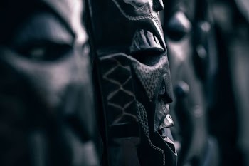 selective focus photograph of black tribal mask decor