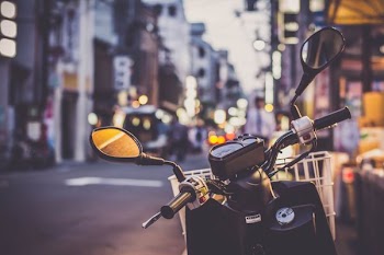 selective focus photograph of motorcycle handlebar