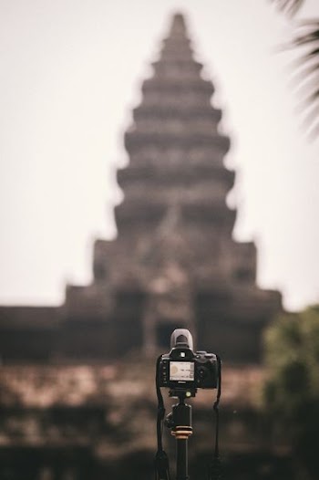 selective focus photography of black DSLR camera