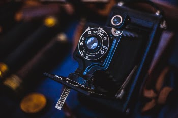 Selective Focus Photography of Black Folding Camera