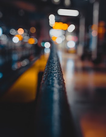 Selective Focus Photography Of Black Metal Bar