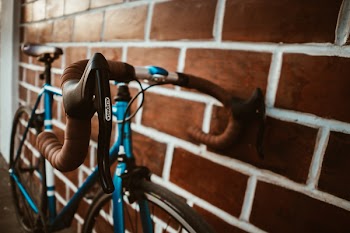 Selective Focus Photography of Blue Road Bike