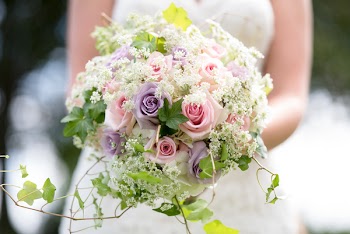Selective Focus Photography of Bride Holding Pink and Purple Hybrid Tea Rose Flowers and White Queen Anne's Lace Flowers Bouquet