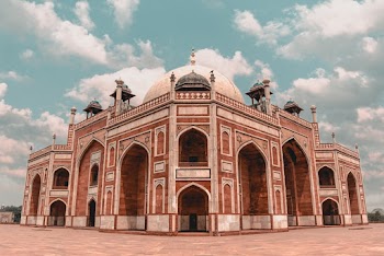Selective Focus Photography Of Brown And White Mosque