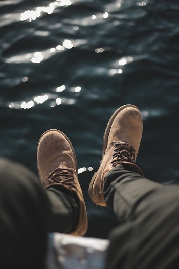 Selective Focus Photography of Brown Working Boots