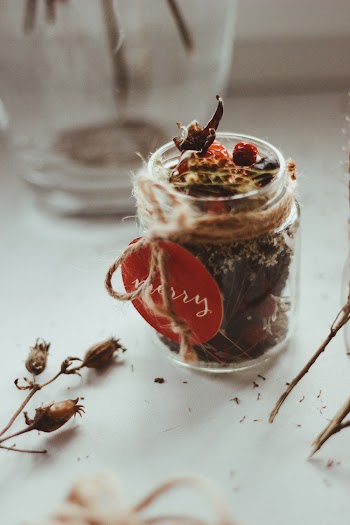 Selective Focus Photography of Clear Jar on White Table