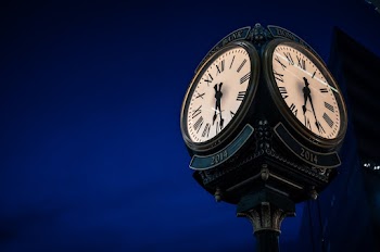 Selective Focus Photography Of Clock At Nighttime