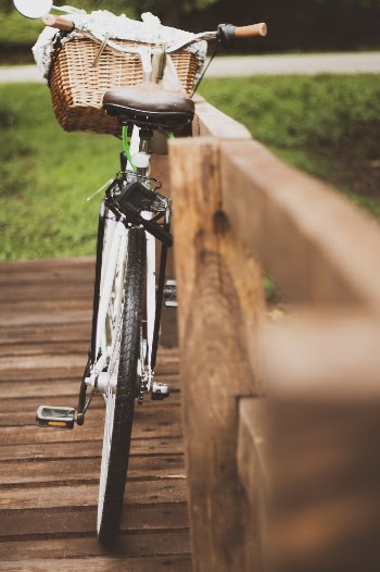 Selective Focus Photography Of Cruiser Bike With Basket 