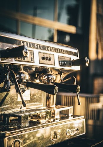 selective focus photography of espresso machine