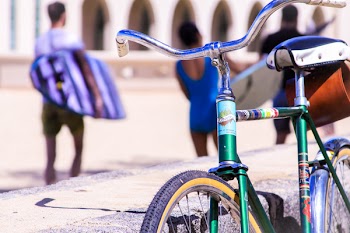 Selective Focus Photography of Green Bike