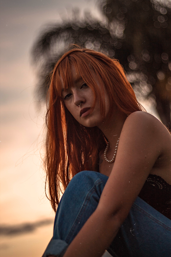 Selective Focus Photography of Long Red-haired Woman