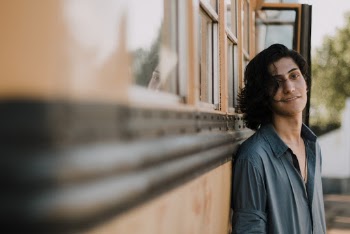 Selective Focus Photography of Man Leaning on School Bus