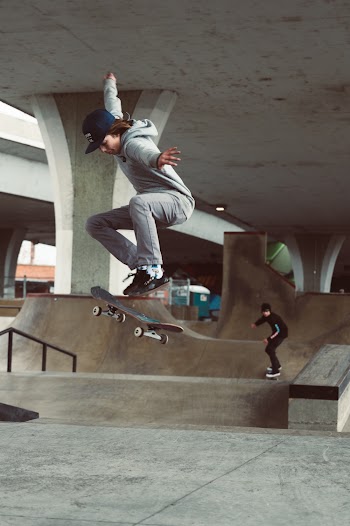 Selective Focus Photography Of Man Riding Skateboard Doing Kick Flip
