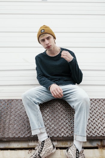 Selective Focus Photography of Man Sitting