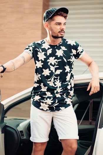 Selective Focus Photography of Man Standing Outside Car With Door Opened