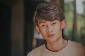 Selective-focus Photography of Man Wearing Beige Crew-neck Shirt