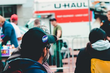 Selective Focus Photography of Man Wearing Black Cap