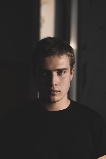 Selective Focus Photography of Man Wearing Black Crew-neck T-shirt