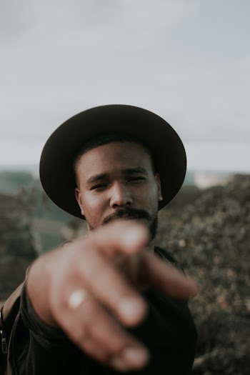 Selective Focus Photography Of Man Wearing Black Hat 