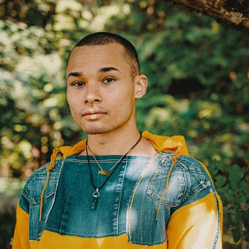 Selective Focus Photography of Man Wearing Blue and Yellow Hoodie