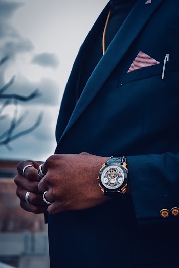 Selective Focus Photography of Man Wearing Blue Suit