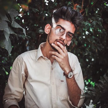 selective focus photography of man wearing brown dress shirt