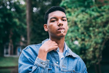 Selective Focus Photography of Man Wearing Jean Jacket