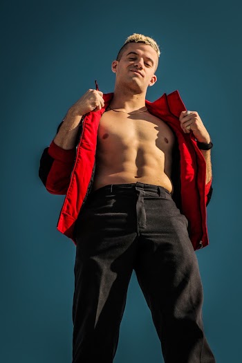 Selective Focus Photography of Man Wearing Red Jacket