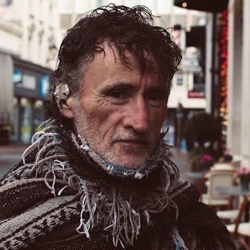 Selective Focus Photography of Man Wearing Scarf