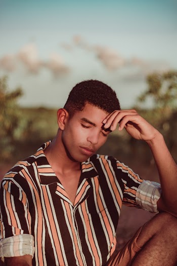 Selective Focus Photography Of Man Wearing Striped Collared Shirt