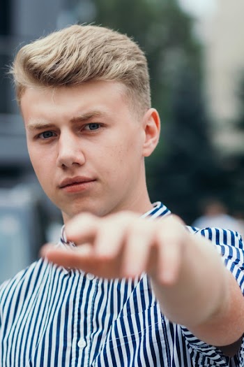 Selective Focus Photography of Man With Blonde Hair