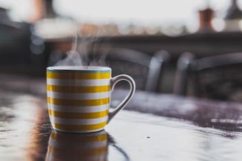 selective focus photography of mug