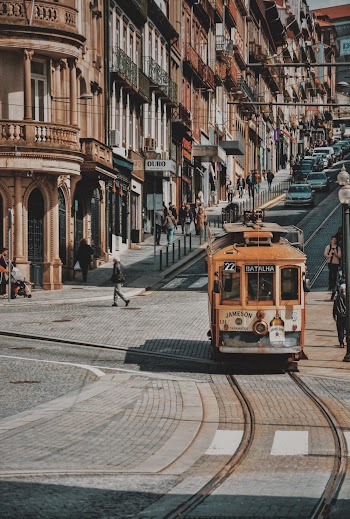 Selective Focus Photography of Orange Tram