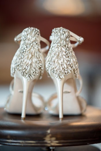 Selective Focus Photography of Pair of Beige Leather Stiletto Sandals