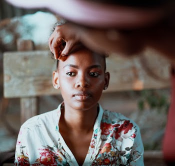 Selective Focus Photography of Person Getting Make-up Done
