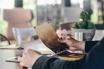 Selective Focus Photography of Person Holding Paper