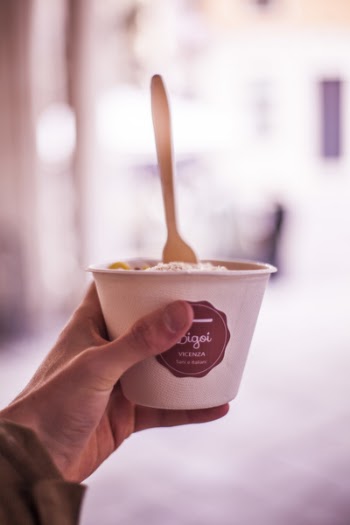 Selective Focus Photography of Person Holding Vacenza Labeled Cup