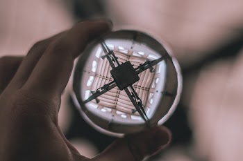 Selective Focus Photography of Person Holding Water Bubble