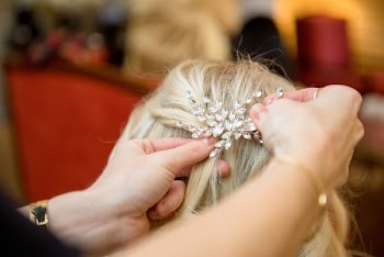 Selective Focus Photography of Person Tying Hair