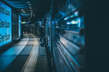 selective focus photography of person walking on subway