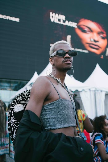 Selective Focus Photography of Person Wearing Hoop Earrings and Black Sunglasses