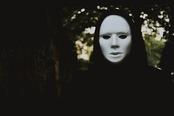 Selective Focus Photography of Person Wearing Mask