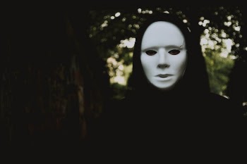 Selective Focus Photography of Person Wearing Mask